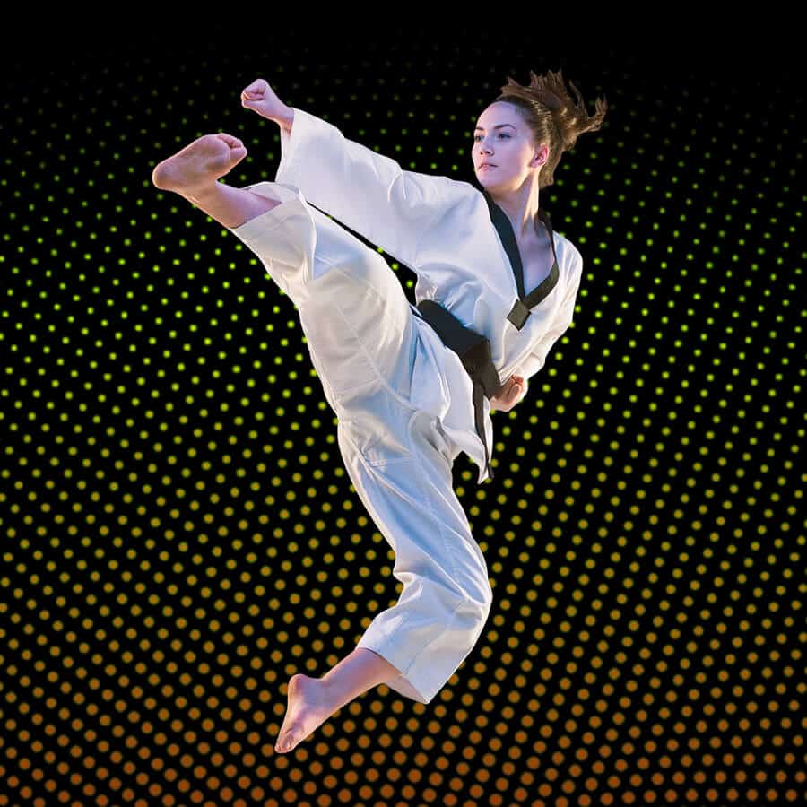 Martial Arts Lessons for Adults in Spring Hill KS - Girl Black Belt Jumping High Kick