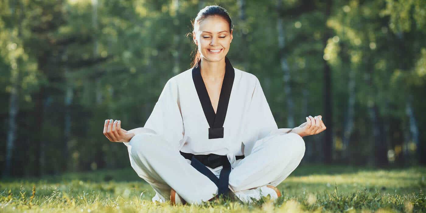 Martial Arts Lessons for Adults in Spring Hill KS - Happy Woman Meditated Sitting Background